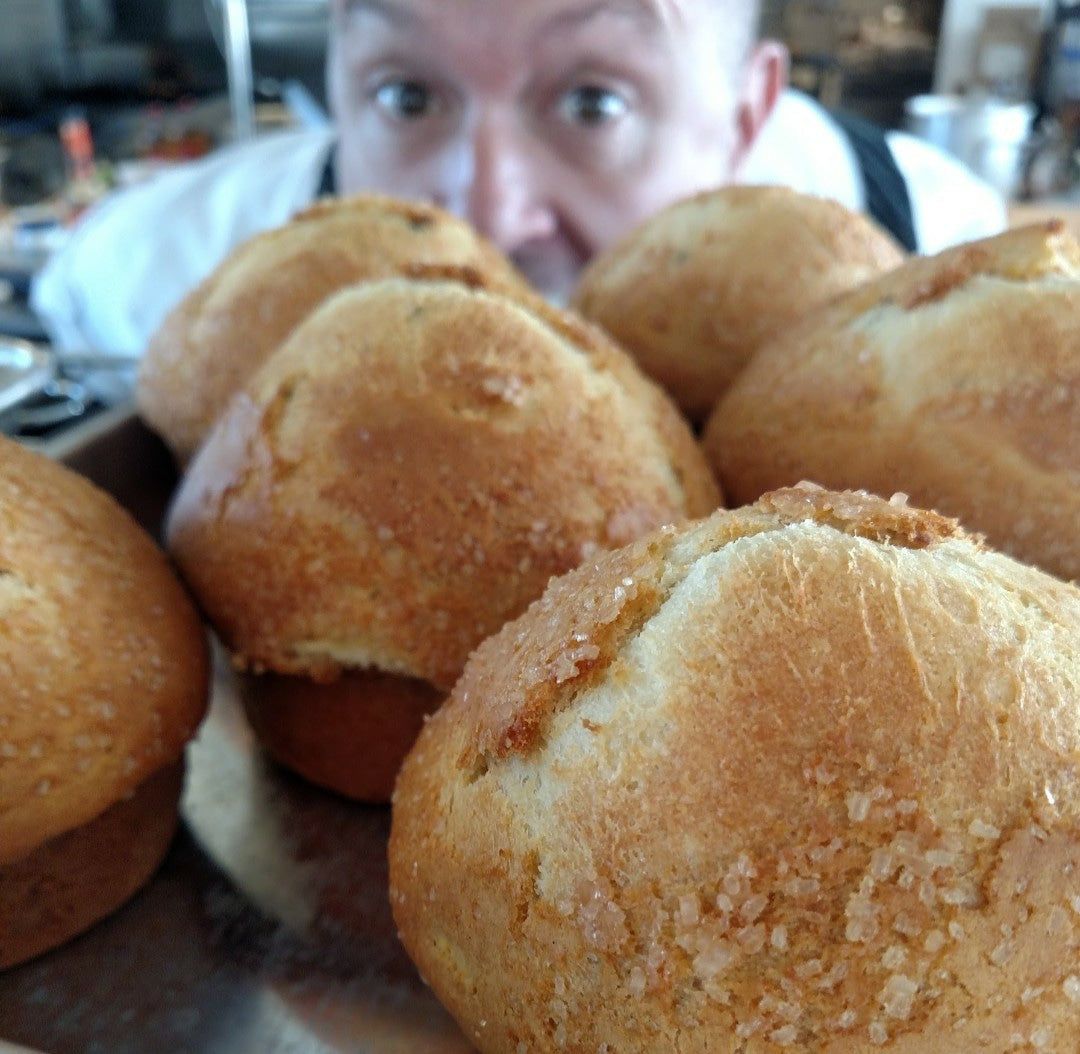 chef paul at the Dotted Lime looks at some freshly baked bread.