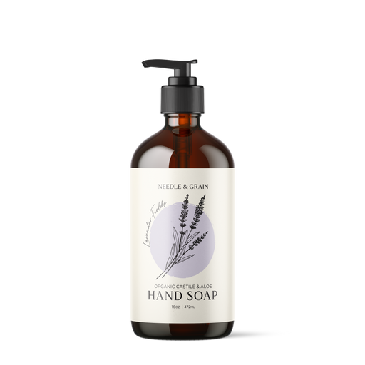 Glass bottle of Lavender Fields hand soap with pump, featuring a minimalist label and natural lavender-inspired packaging"